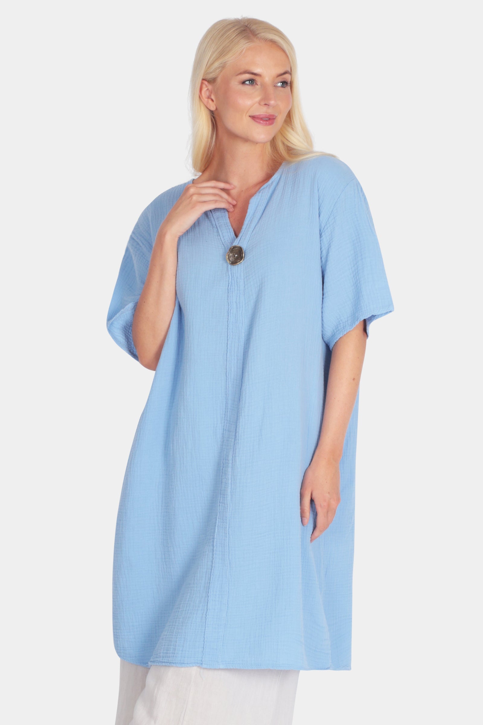 Gia Notch Neck Tunic Dress in light blue cotton with relaxed fit, short sleeves, notch V-neck, and button accent on front seam.
