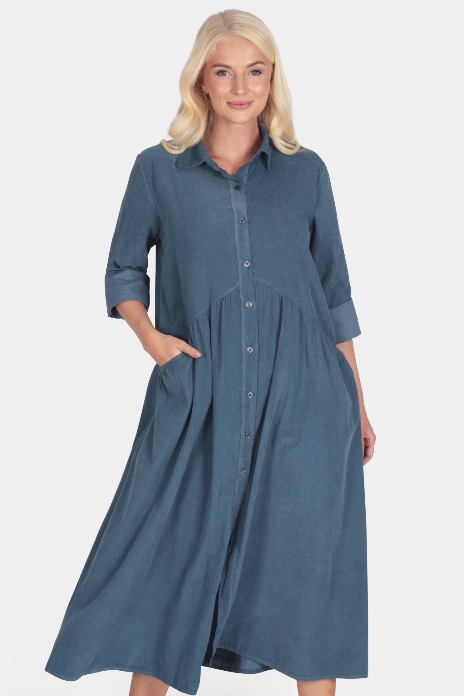 Woman wearing a blue soft corduroy shirt smock dress 