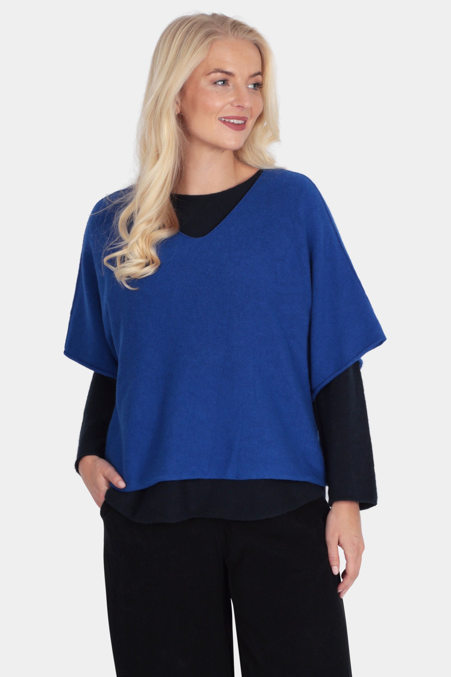 Woman wearing a blue and black outfit on a white background